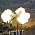 Israeli artillery fires toward Lebanon from a position near the northern town of Kiryat Shmona following Hezbollah rocket fire from the Lebanese side of the border, on August 6, 2021 (JALAA MAREY / AFP)