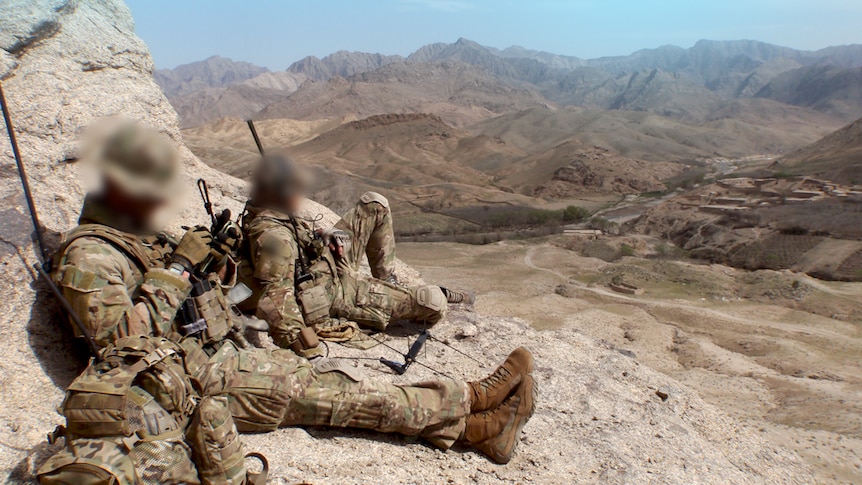 3 Squadron SAS soldiers rest on a mountain in Afghanistan in 2012.