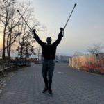 Cory Moses walking with his forearm crutches.